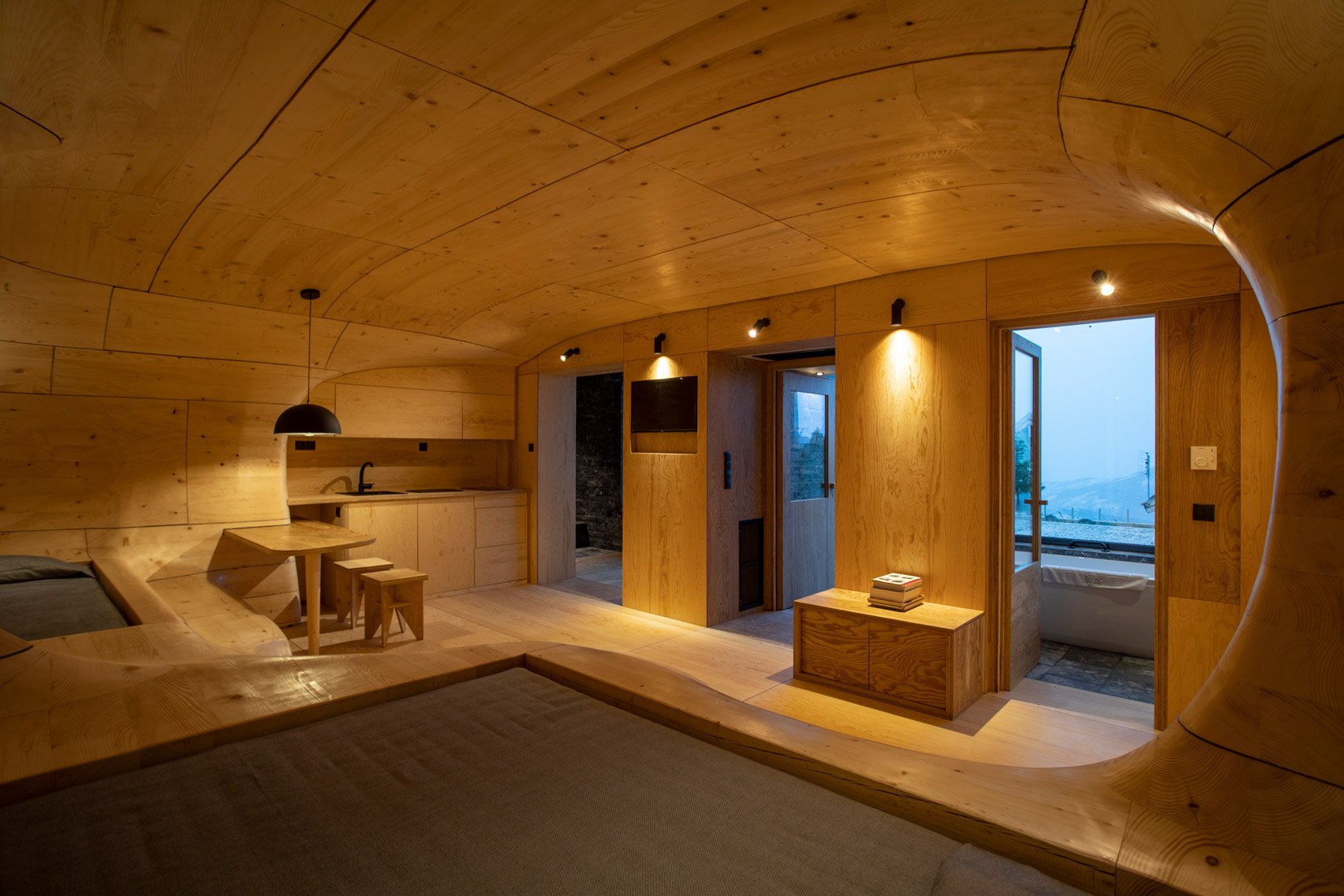 Wooden Cave hotel suite in Greece is made from over 1,000 pieces of hand-cut spruce