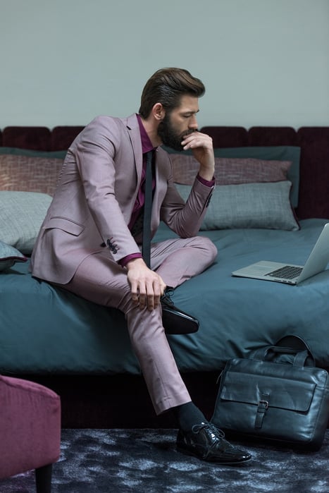 business traveler in a chic hotel room_lithology collection fr fabrics