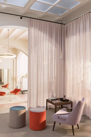 fr sheer curtains and an elegant armchair with poufs_lucence collection