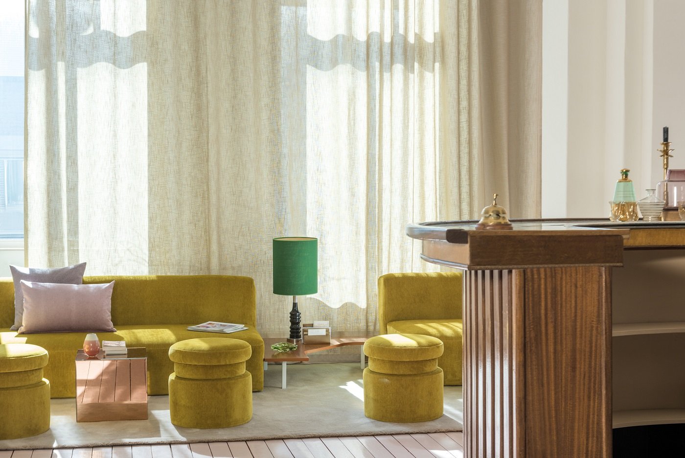 sunny yellow lobby with flowy sheer curtains_lithology collection fr fabrics